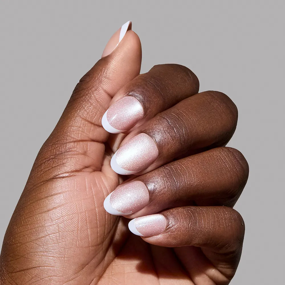 Angelic Touch press-on nails in soft pink Love Notes design featuring almond shape stylish nail set on hand display