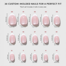 Angelic Touch press-on nails in Love Notes style showing soft pink almond-shaped nails on a hand model product display photo