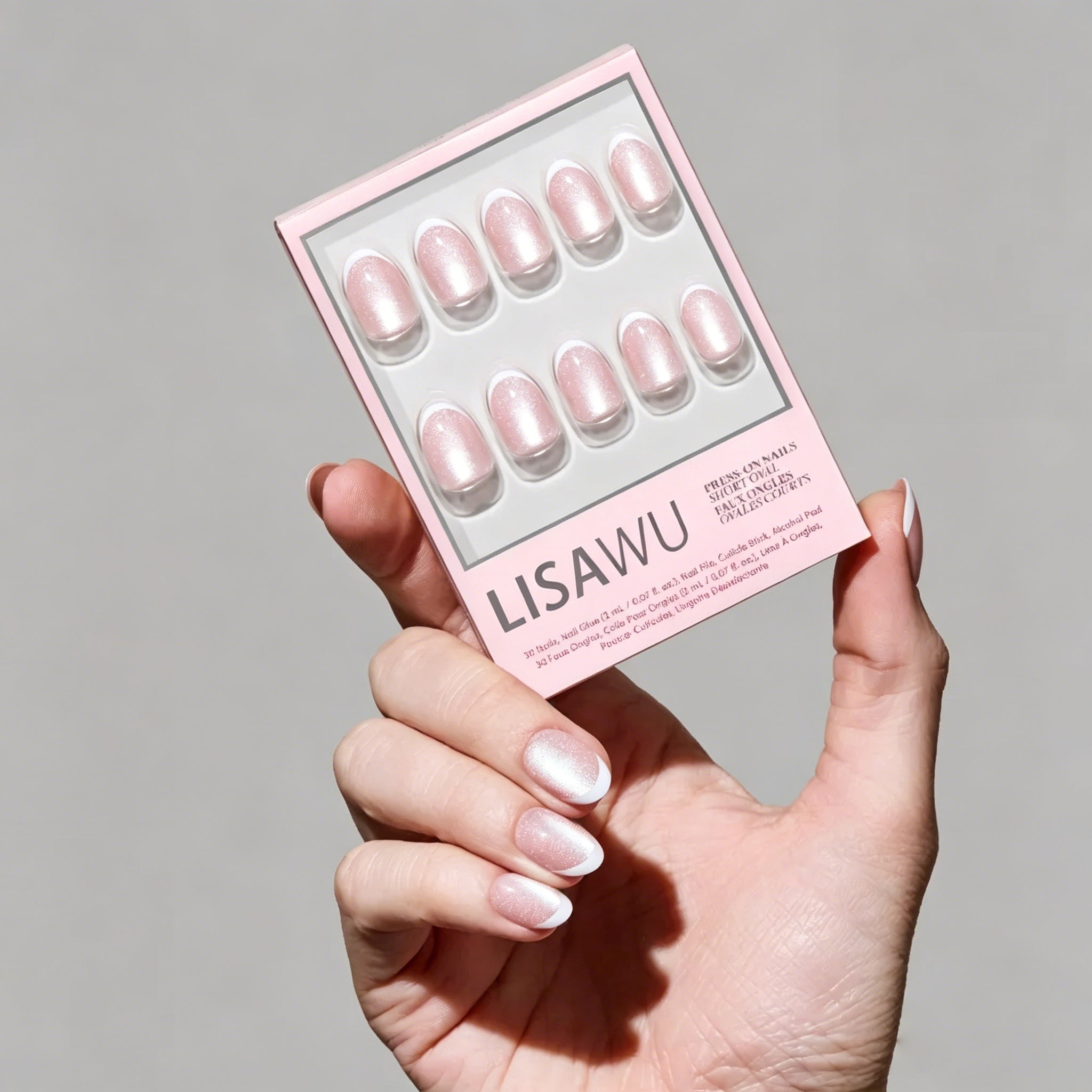 Angelic Touch press-on nails in soft pastel colors with almond shape and glossy finish on natural nails