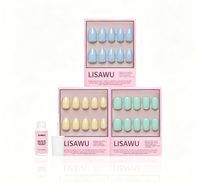 Anns Palette colorful press-on nails set featuring vibrant mixed shades and glossy finish on medium-length nails