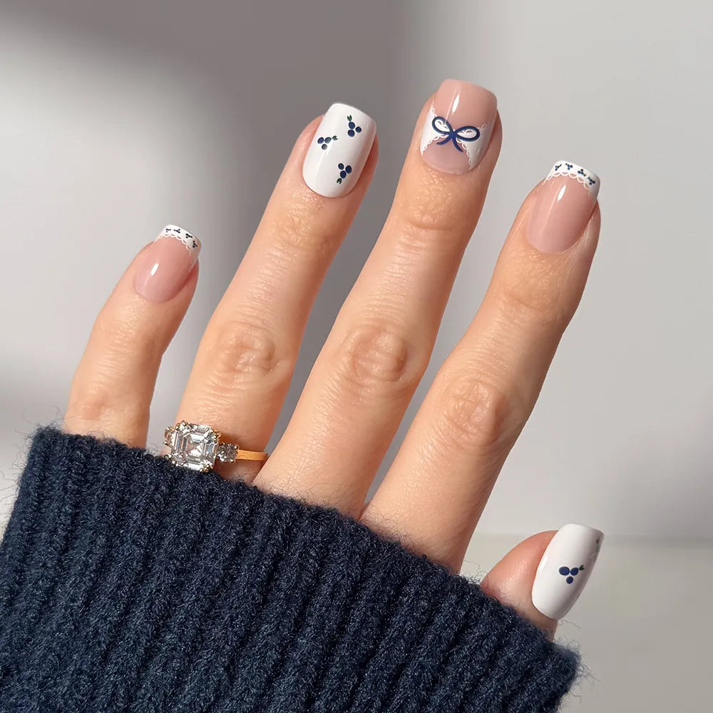 Blue A Kiss press-on nails in vibrant blue with heart and love note designs stylish nail set for elegant manicure