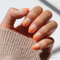 Candy Corn press-on nail set with orange, white, and yellow gradient design