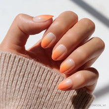 Candy Corn press-on nail set with orange, white, and yellow gradient design