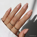 Exposed press-on nails in nude shade