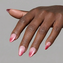Faded Feelings press-on nails in soft gradient colors styled in almond shape elegant nail set on hand close-up