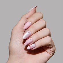 Love Knot press-on nails in love notes design showing elegant knot pattern on almond-shaped nails product display photo