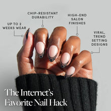 Love Noir press-on nails in black matte finish with elegant almond shape stylish nail set on hand close-up