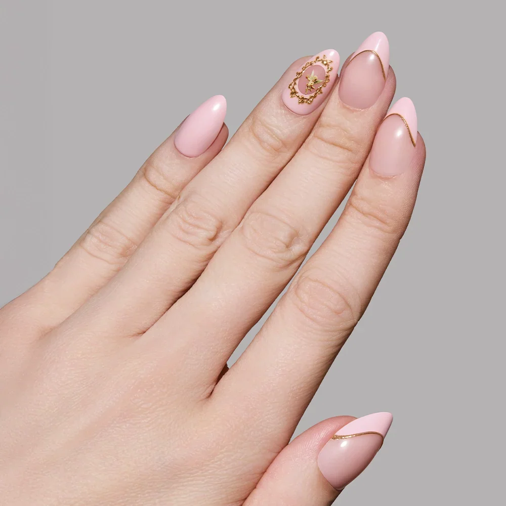 Lovers Crest press-on nails featuring elegant heart-shaped design in soft pink and red tones, stylish nail set display
