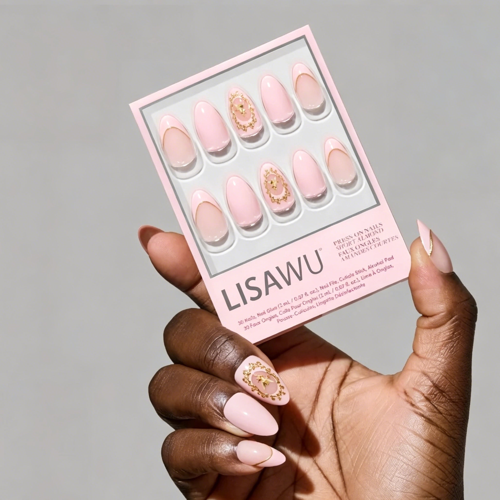 Lovers Crest press-on nails featuring elegant heart-shaped design in soft pink and red shades, stylish nail set for romantic