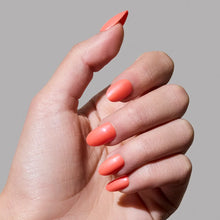 Lush Coral press-on nails in vibrant coral shade with almond shape for stylish manicure and easy nail set application