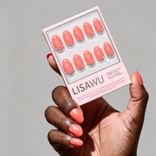 Lush Coral press-on nails in vibrant coral shade with glossy finish and rounded nail shape perfect for summer style