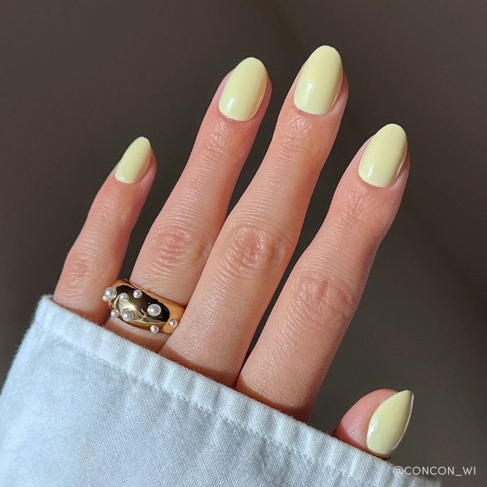 Pastel yellow press-on nails with soft matte finish in almond shape ideal for spring nail set