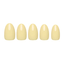 Pastel yellow press-on nails in soft matte finish nail set showcasing elegant oval nail shape
