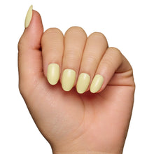 Pastel yellow press-on nails with glossy finish showcasing soft spring nail style