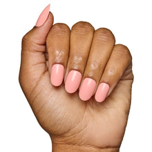 Peach coral press-on nails in glossy finish with rounded shape vibrant nail set display