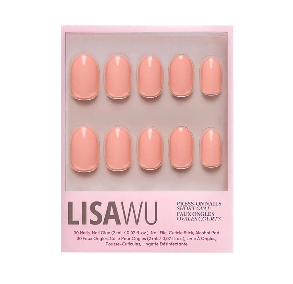 Peach Coral press-on nails in soft coral shade with glossy finish elegant nail set display