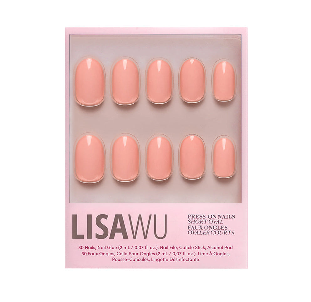 Peach Coral press-on nails in soft coral shade with glossy finish elegant nail set display