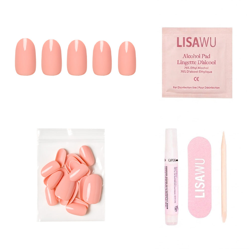 Peach Coral press-on nails in soft coral shade with glossy finish displayed on hand model