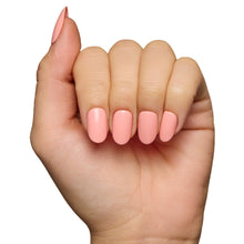 Peach coral press-on nails with glossy finish showcasing elegant square shape for stylish nail set display