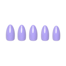 Periwinkle press-on nail set featuring soft pastel blue nails with a glossy finish on natural hand background