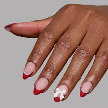 Ruby Ribbons press-on nail set from the Snowed In collection