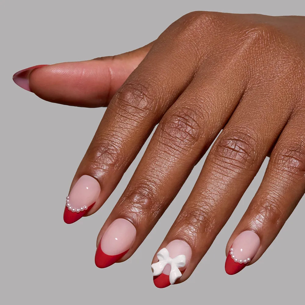 Ruby Ribbons press-on nail set from the Snowed In collection