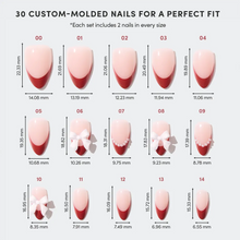 Ruby Ribbons red holiday themed press-on nail set close up