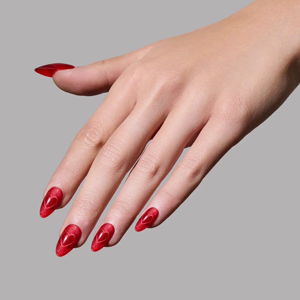 Sent with Love press-on nails set featuring elegant heart designs in soft pink and red tones on almond-shaped nails