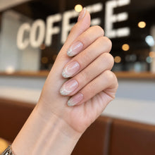Close-up view of LISAWU Silver Crescent short oval press-on nails highlighting the smooth shape and reflective nail details.