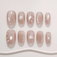 Detailed product view of LISAWU Silver Crescent short oval press-on nails with a refined silver-inspired finish.