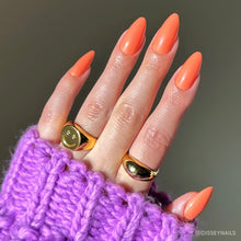 Soft Tangerine press-on nails with soft orange shade and natural oval shape perfect for everyday wear