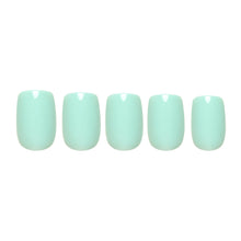 Soft teal press-on nails in a smooth matte finish showcasing elegant oval shape nail set display