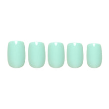Soft teal press-on nails in a smooth matte finish showcasing elegant oval shape nail set display